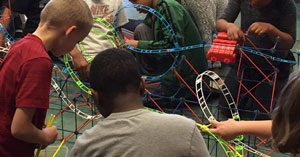Children building a roller coaster at Building Up: Architecture Program