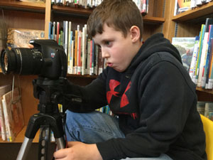 A film lab participant prepares to shoot