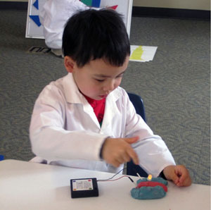 Using squishy circuits, participants learned that circuits must be closed in order to help electricity flow and light the LED