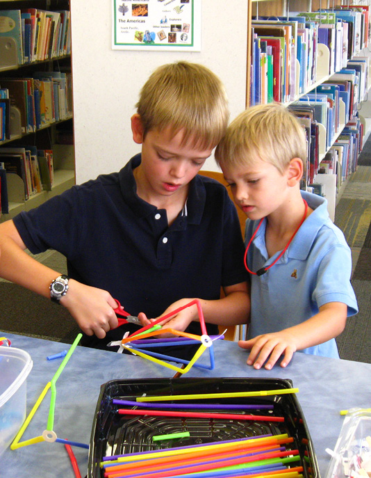 Children building with pipecleaners