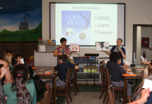 Teacher Kathi Stalzer and school librarian Debra LaPlante at Saints Simon and Jude Cathedral School in Phoenix, Arizona, co-teaching a strategy lesson with fourth-grade students.