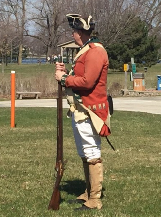 One of the re-enactors, complete with gun and tri-corner hat