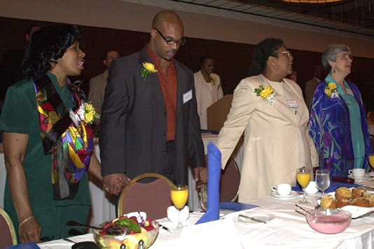 Attendees of the 2002 Coretta Scott King Book Awards Breakfast join in song at ALA Annual in Atlanta, Georgia.