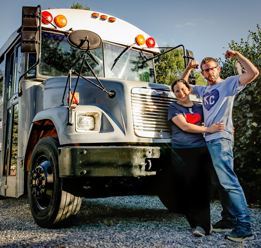 Robbi Behr and Matthew Swanson in front of their school bus.