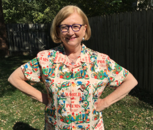 Dig that shirt! Anthologist Sylvia Vardell models a shirt emblazoned with her book jacket art!