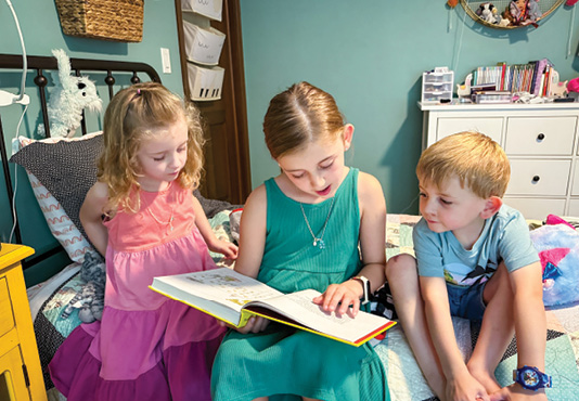 Children reading in a child'''s bedroom